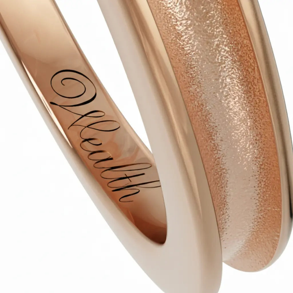 Inner engraving of a Dimis Designs grooved 18K rose solid gold ring, hand-engraved with an intention mantra