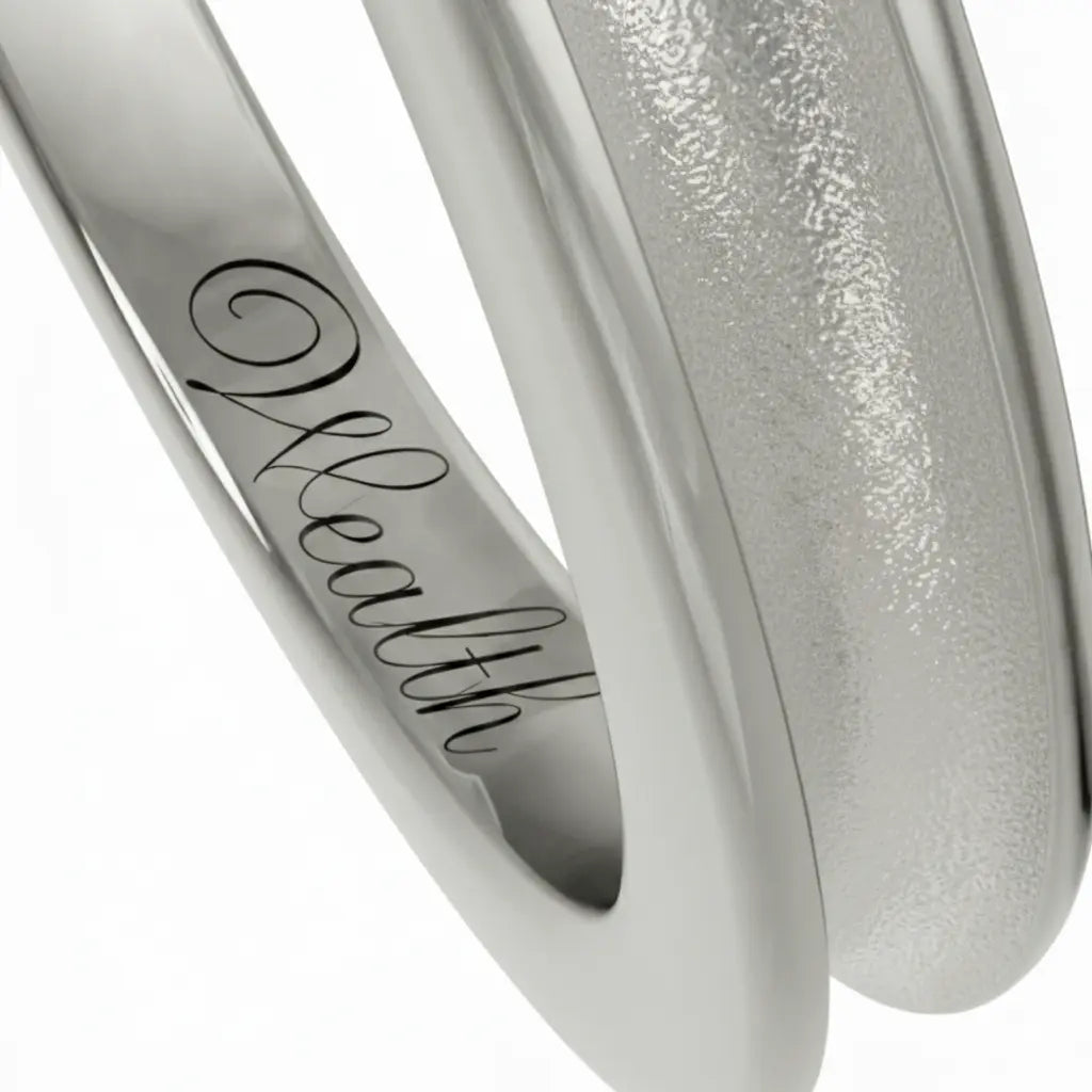 Inner engraving of a Dimis Designs grooved platinum ring, hand-engraved with an intention mantra