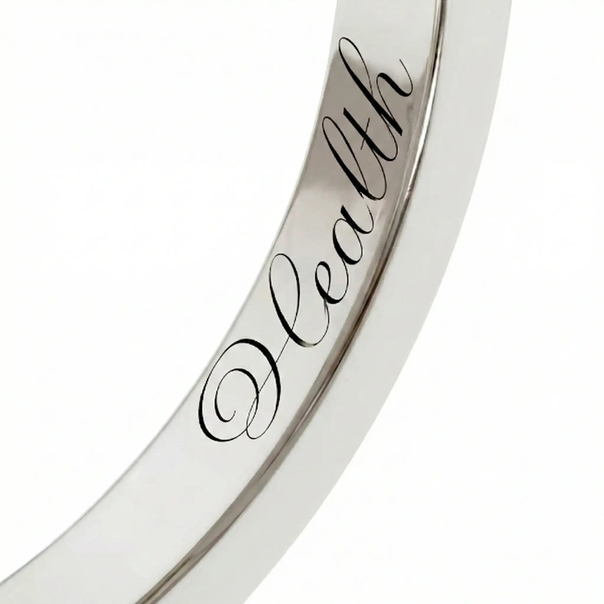 Close-up of inner engraving on a Dimis Designs platinum square ring with hand-engraved words